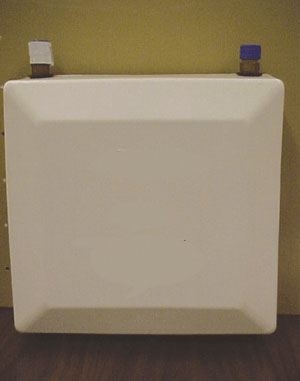 Photo 1. Example of a tankless water heater about the size of a large briefcase