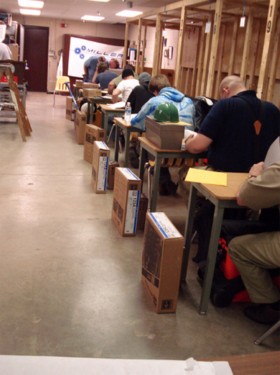 Photo 1. Students Take Written Exam. Each student was required to take a written exam before demonstrating their hands-on skills.