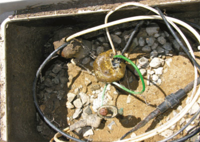 Photo 3. this equipment grounding conductor was not installed with the branch circuit to the service pedestal in the conduit (top left). the streetlight was 
