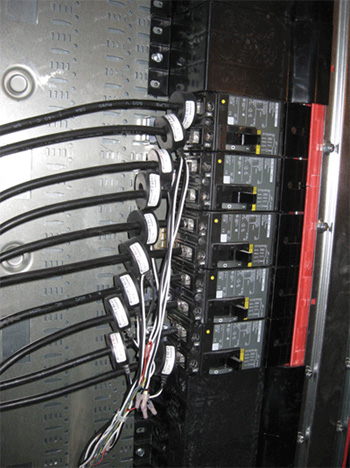 Photo 5. Rule 12-3032(4) allows installation of wiring associated with instrument transformers and energy usage metering devices in enclosures for overcurrent devices, etc.