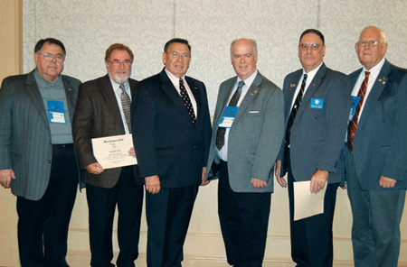 Photo 1. Chuck Mello and Mark Ode were inducted into the Roadrunner Club. Left to right, John Minick, Mark Ode, Richard Loyd, Mark Earley, Chuck Mello and James Carpenter.