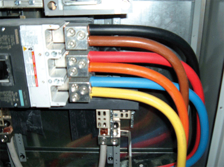 Photos 3 and 4. Various ways of conductor identification for feeders, some code-compliant and some not so.