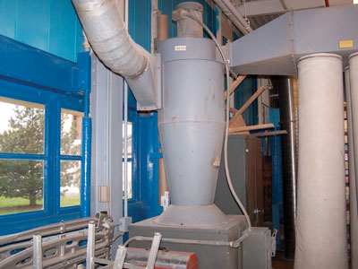 Photo 3. Typical dust collection system (equipment shown inside of structure)