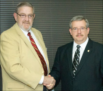 Photo 1. Stan Benton passes the presidency to Steve Douglas.