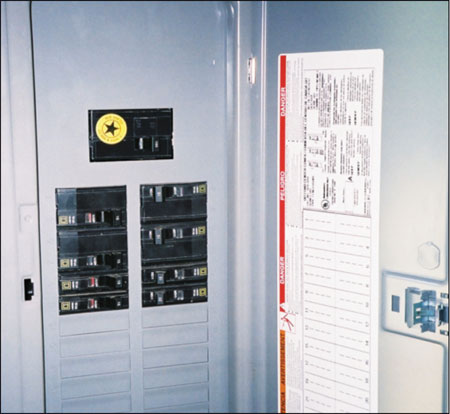 Photo 1. Load Center/Panelboard. Rated at 100 amps with 160 amps of supply breakers
