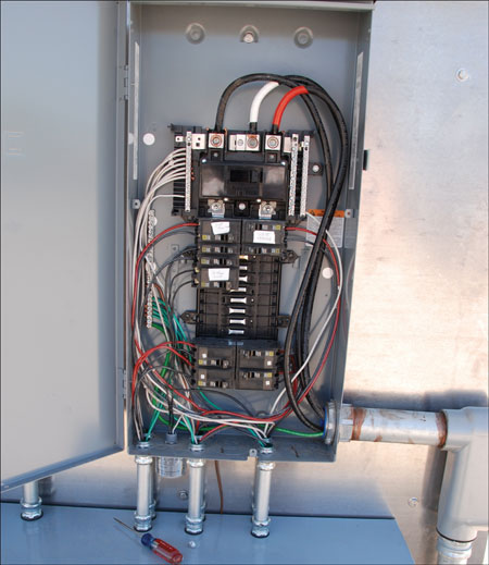 Photo 2. Panelboard with PV breakers in the correct location — opposite the main lugs. 