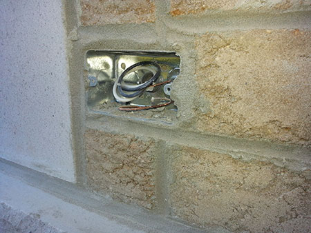 Photo 12 shows an example, a flush box installed in a masonry wall that is not approved for installation in a masonry wall and will not provide a sufficient seal between the outlet box and the cover plate.
