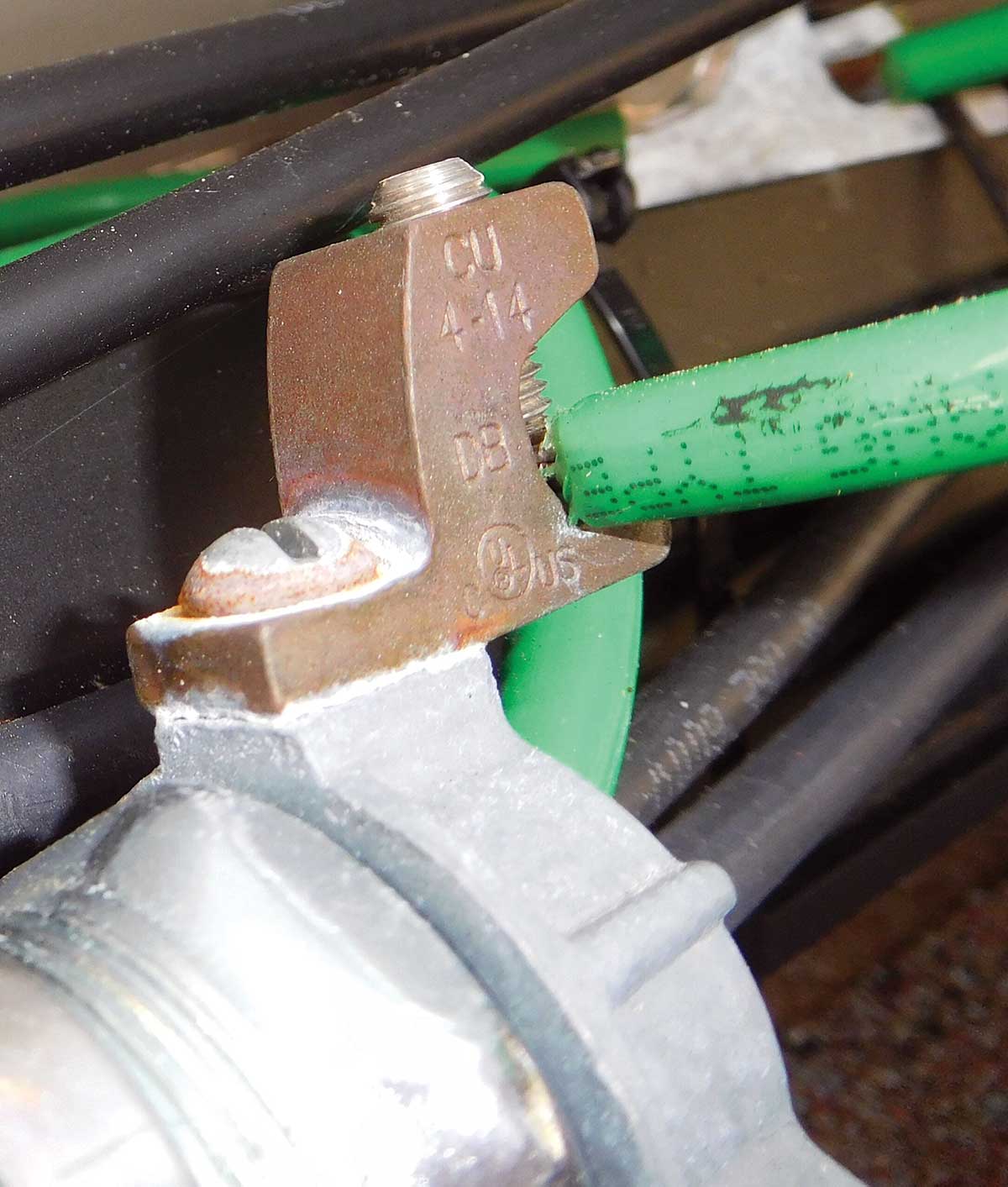 Photo 2 (left). Replacing the lug on a bonding bushing may seem like a simple solution in an outdoor environment, but in addition to violating the product listing, the attempted solution didn’t completely solve the problem. Photo courtesy of Chris Houtz.