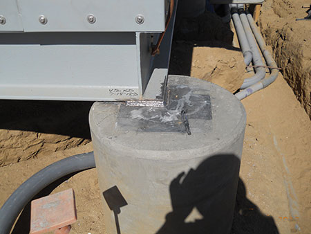 Photo 19. Control structure is attached to support pier and welding is verified by Special Inspection.