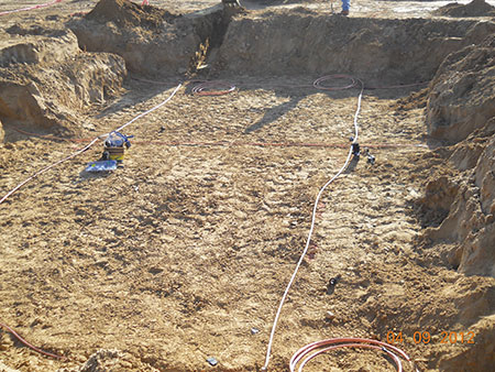 Photo 6. To prep transformer location, the soil is over excavated, re-compacted, and inspected; then the GND mat is installed and the foundation is built over the engineered GND mat.