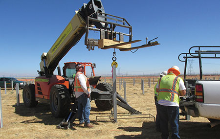 Photo 10B. Performing vertical pull test of pile.