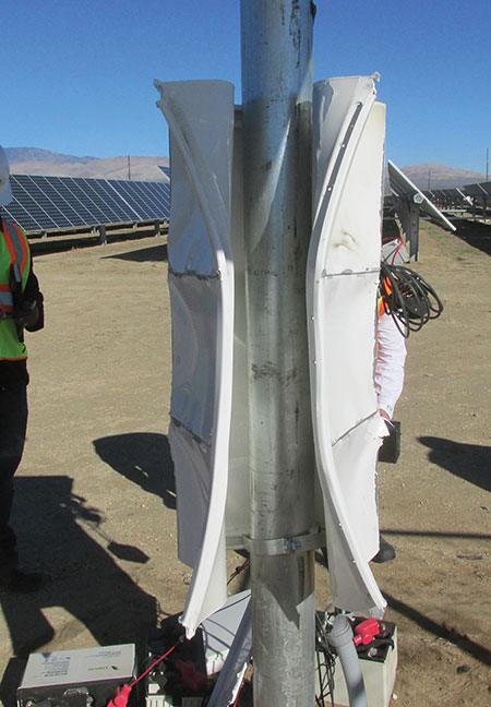 Photo 8B. The event caused the sides of the heavy gauge enclosure to wrap backwards around the support pole.