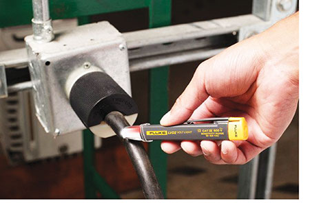 Photo 4. Voltage presence detection [on photo: Fluke volt tester pen for commercial and industrial applications]