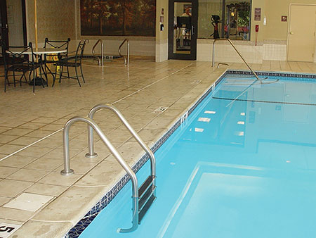Photo 1. Bonded parts such as metallic ladders, luminaire housings, and rails with 9 in.2 in contact with the pool water can serve to bond the pool water.