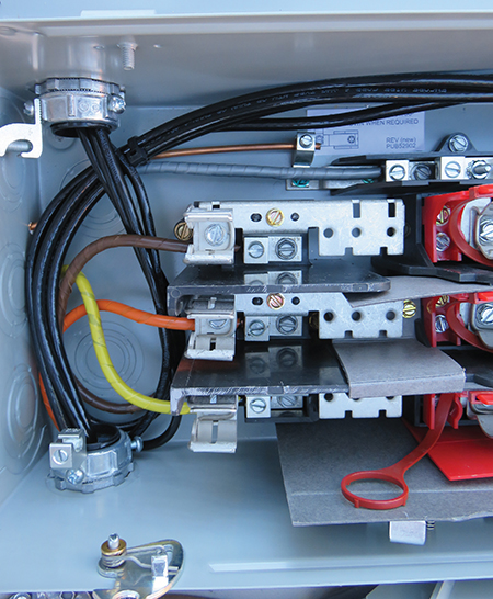 Photo 12. Conductors from the Parallel Power Production Source terminate at the load side of the switch. Grounding electrode connection (bare # 6 in this example) is also shown.