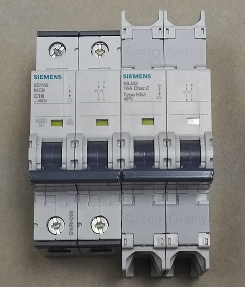 Photo 10. An example of a Siemens supplementary protector (on the left), and a Siemens circuit breaker (on the right). Note the extra spacing between the line terminals and the between the load terminals.