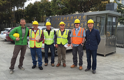Photo 7. Special inspectors (wearing orange and yellow safety vests) arrive in China for shop inspections. 