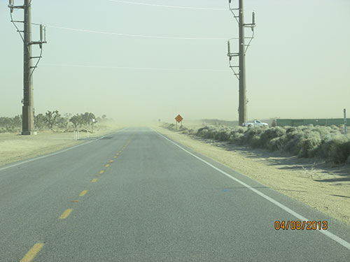 Photo 1A. Uncontrolled dust migrating off a large PV site.