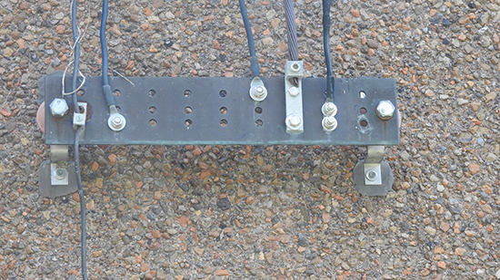 Figure 1. This old ground bonding bar will be replaced, wiring errors corrected and conductors here and internally (Figure 2) upsized to 4/0 stranded copper conductors to ensure adequate current carrying capacity to the ground field.