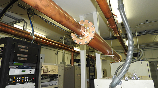 Figure 5. Waveguide pipes are used in the building because it is transmitting FM signals. The first thing West is doing is completing the existing bonding connections to all the proper points for the waveguides and the bank of electronics.
