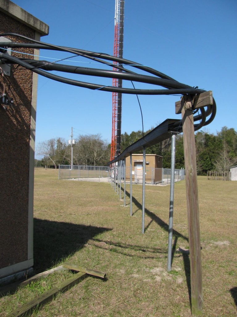 Figure 4. The ground system is tied to the waveguide bridge and to the facility’s bulkhead grounding bar, as well as a halo ground with 4/0 stranded copper. The waveguides and bridge are not grounded to the tower; they are properly grounded to the facility.