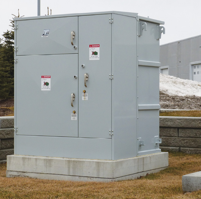 Photo 1. Picture of a 27.6kV unit substation that includes a supply connection termination compartment, a main loadbreak switch with visible isolation, high voltage fusing, 1000 kVA transformer and a 600Y/347V low voltage termination compartment.   Courtesy of PBW High Voltage LTD.