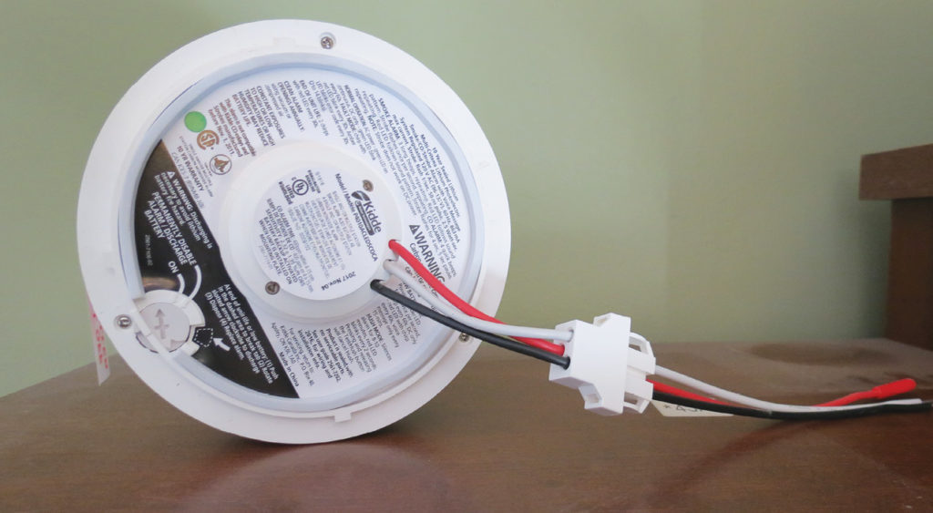 Photo 5.  An example of a combination smoke alarm and carbon monoxide alarm with an integral battery that is now allowed on a branch circuit that has arc-fault protection.