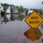 High Water Sign in Flood Damaged area, look for water damaged electrical systems