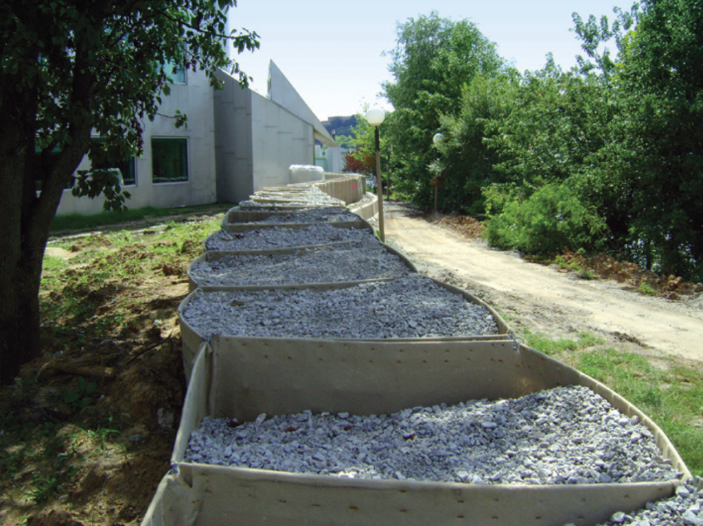 Photo 4. Gravel-filled containers formed a barrier to protect University of Iowa facilities during a flood event (2008). 