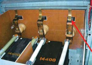 Photo 10.  Medium voltage draw-out type switch with ground straps.