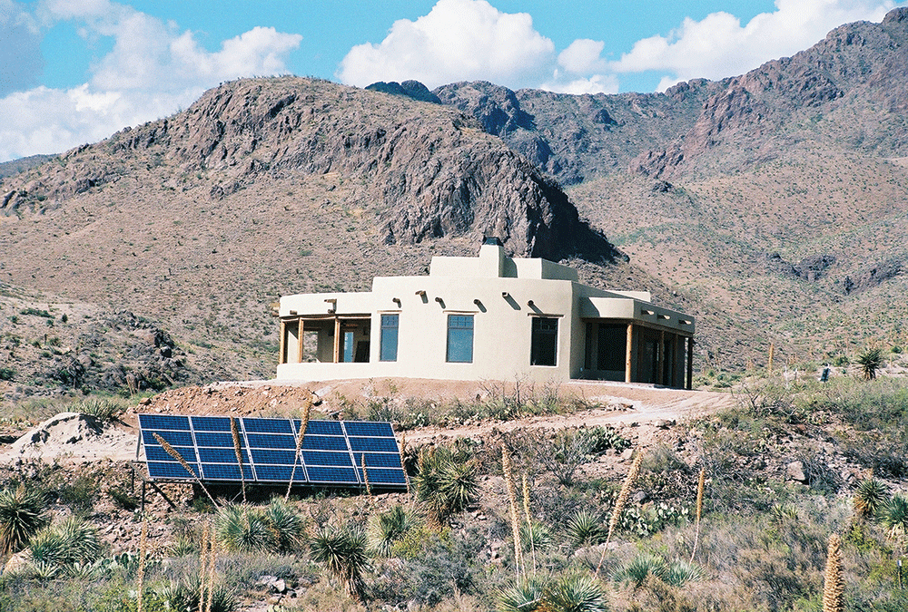 Photo 5. Stand-alone, off-grid PV system includes battery bank and back-up generator (not shown).  Courtesy of John Wiles