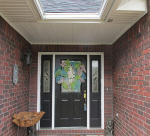 Photo 1d. A porch location where the receptacle outlet on the porch and in the soffit have been determined to be in a damp location by the AHJ.