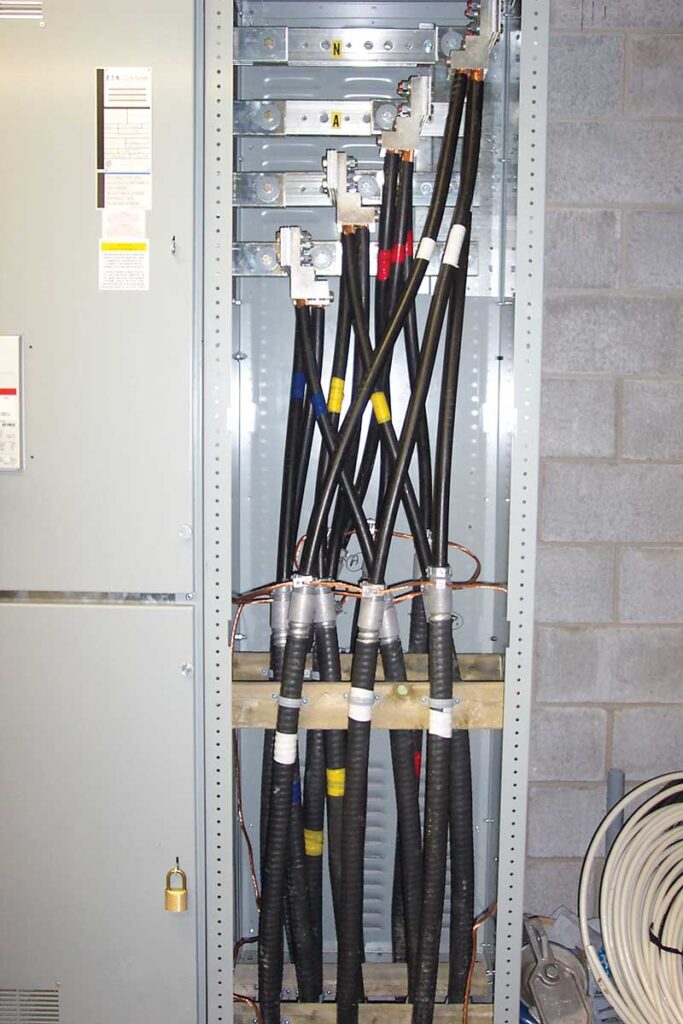 Photo 4. An example of insulated conductor at least 1.2 m long terminating within a distribution panel.