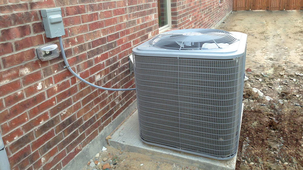 Photo 1. Typical outside A/C unit supplied by an outdoor outlet (disconnecting means).