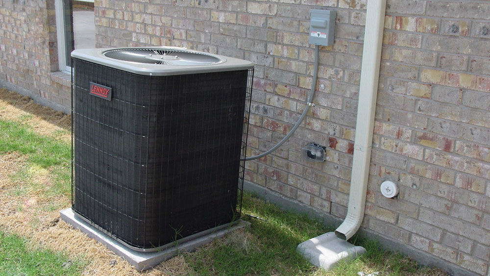 Photo 2: Typical A/C equipment located outdoors at a dwelling unit