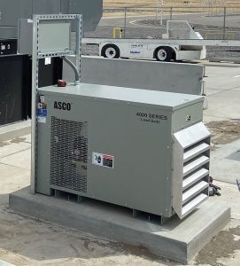 Photo 6. A 75 KW resistive load bank is programmed to work with the building load to automatically maintain a 40% load on the generator.