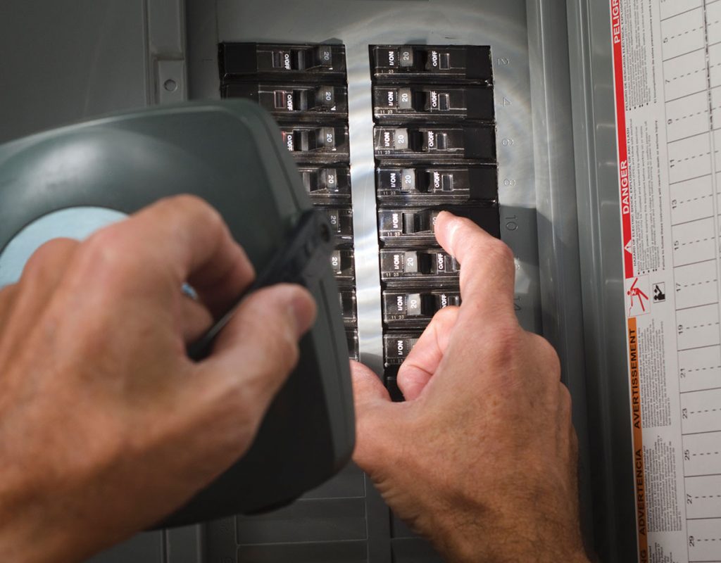 Photo 2. Testing a residential circuit breaker panel