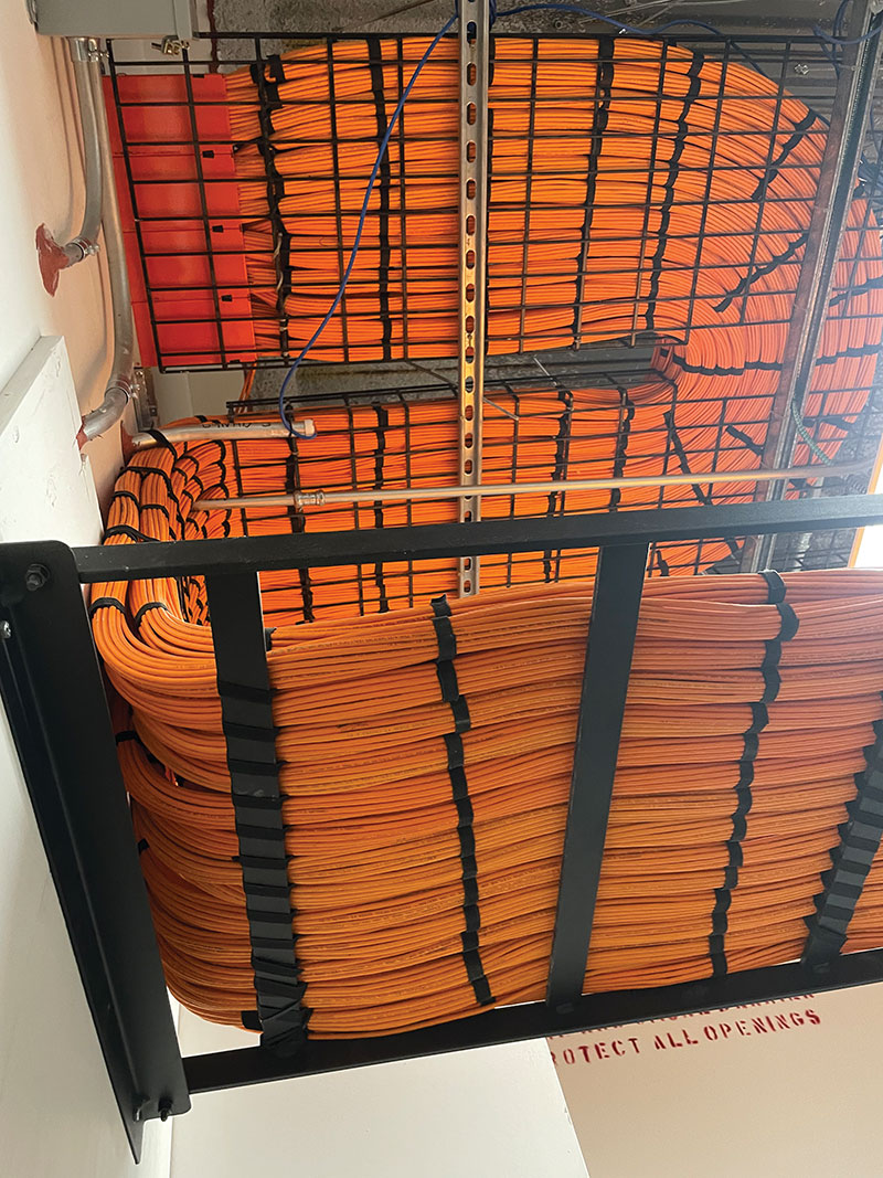 Photo 2. High-density cabling in overhead trays.